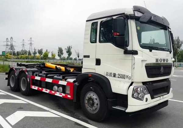 Hook arm garbage truck