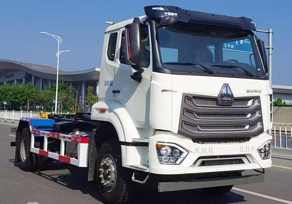 Hook arm garbage truck